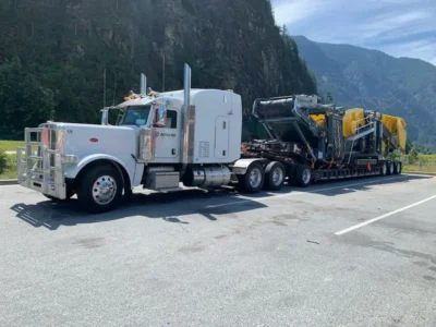 Bowline Heavy Truck Hauling Construction Equipment in Mountains Bowline Heavy Truck Hauling Construction Equipment in Mountains