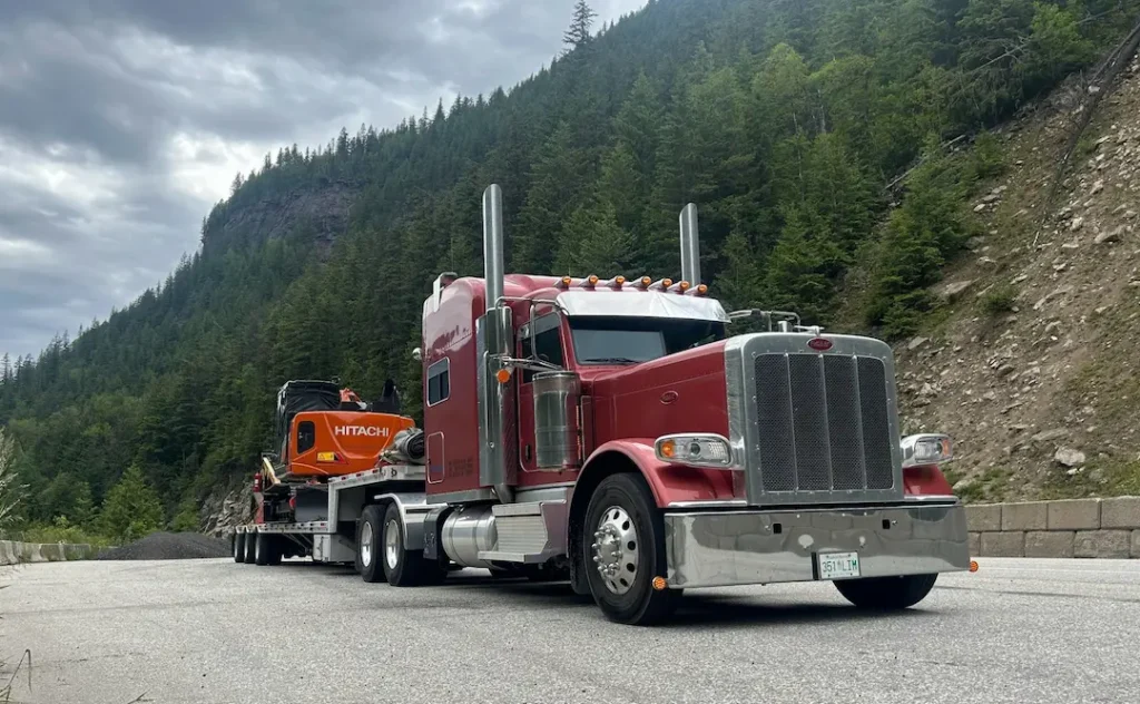 Equipment Moving Review Bowline heavy truck hauling equipment through the mountains