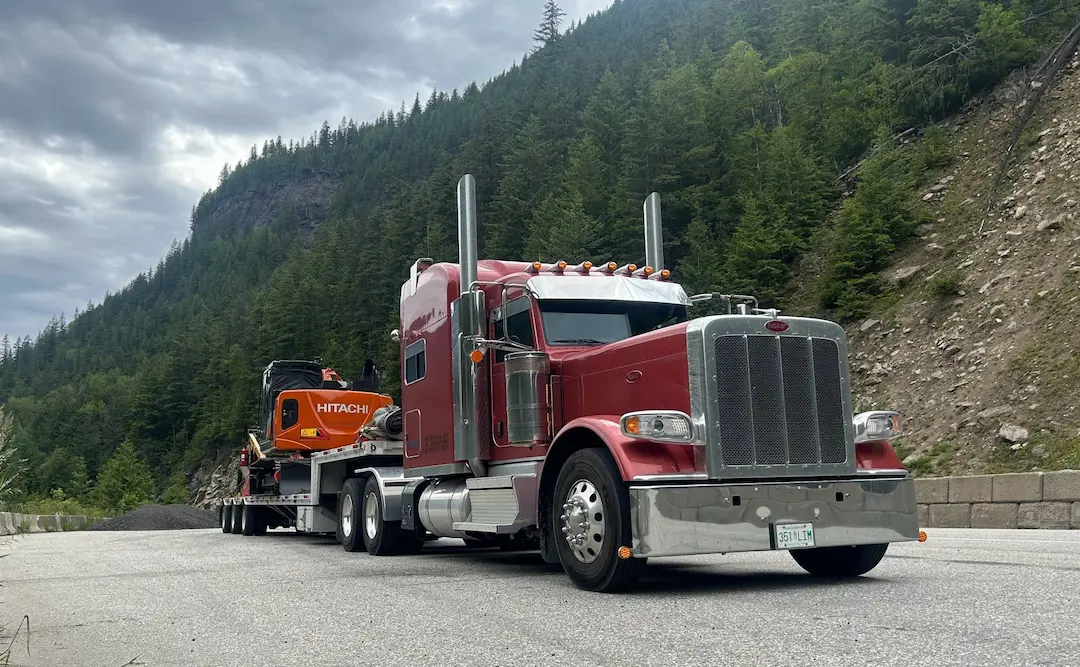 Equipment Moving Review Bowline heavy truck hauling equipment through the mountains