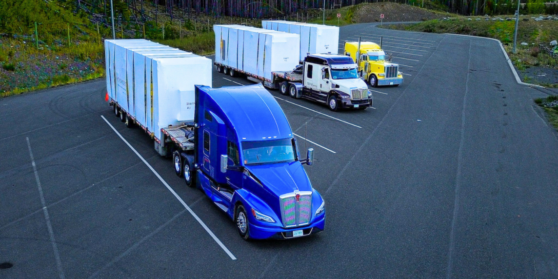 Multiple Bowline Logistics trucks hauling containers down the highway
