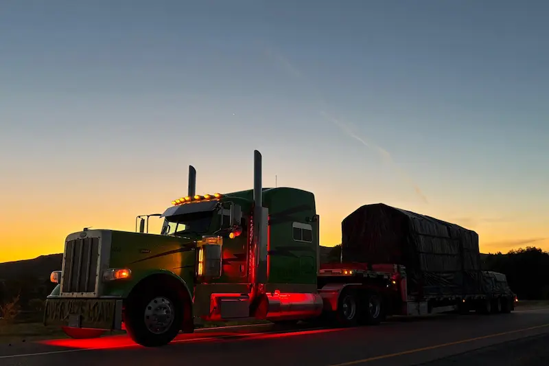 Bowline Logistics Heavy Truck Lit Up at Dusk