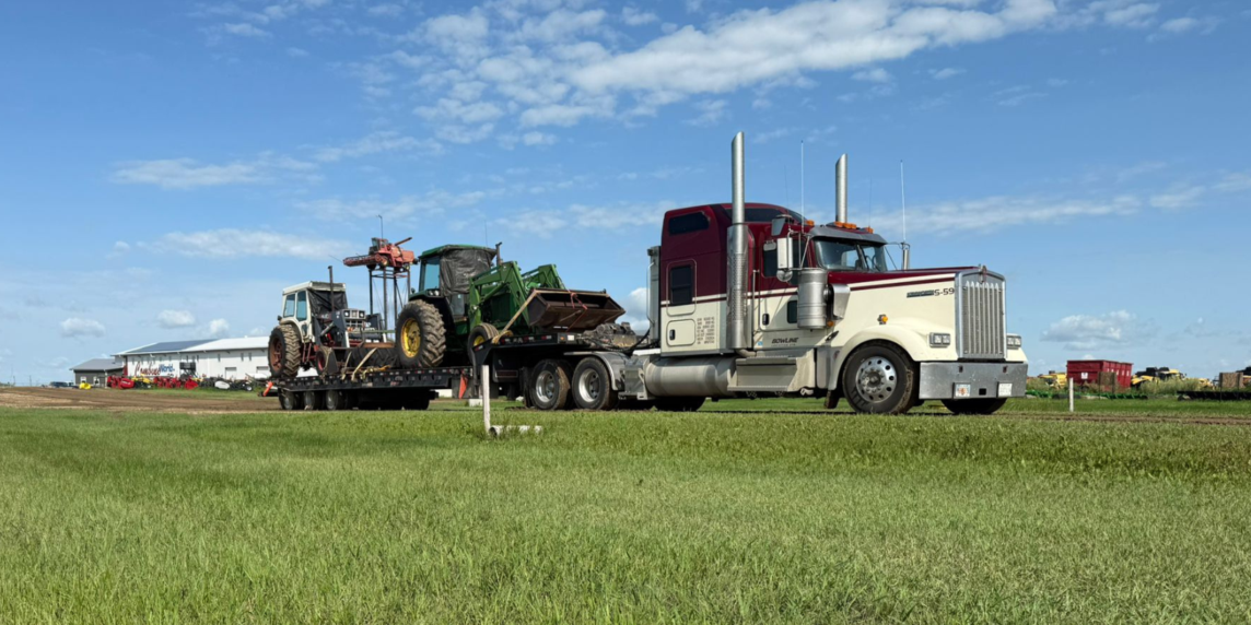 Bowline truck hauling large industrial equipment on a Low Pro trailer in Western Canada.