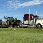 Bowline truck hauling large industrial equipment on a Low Pro trailer in Western Canada.